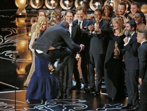 Steve McQueen jumping for joy after accepting the award for Best Film for 12 Years a Slave
